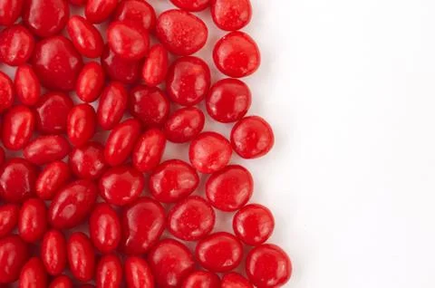 Red candy on blank white canvas Stock Photos