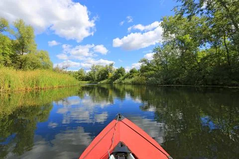 Red canoe in nice river Stock Photos