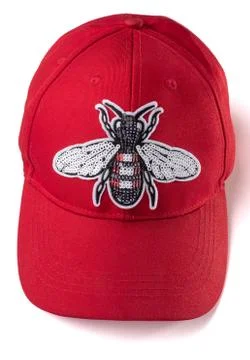 Red cap with a silver sequin fly patch on white background Stock Photos
