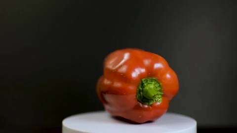 Red Capsicum rotating with black background Stock Footage 233684638
