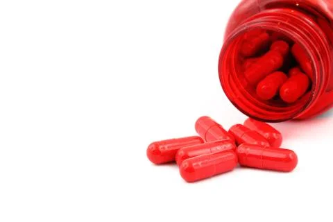 Red capsules close-up. Stock Photos
