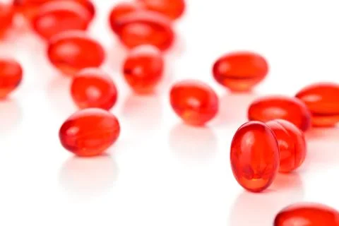Red capsules. Stock Photos