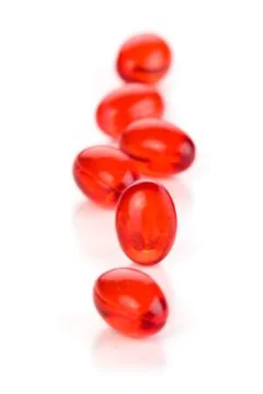 Red capsules. Stock Photos