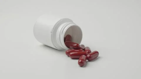 Red Capsules Spilled From Plastic Bottle Stock Footage 346972415