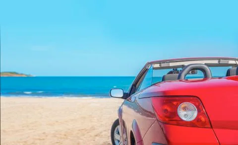 Red car on the beach. Stock Photos