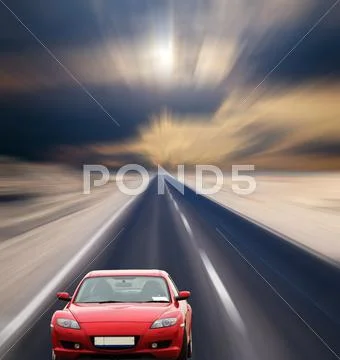 Red car on desert road Stock Photos