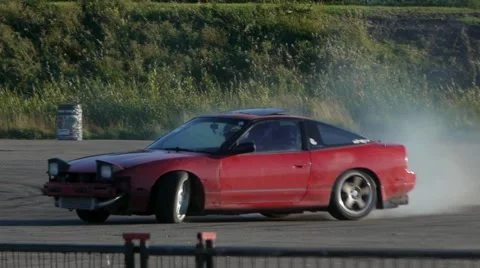 Red car does massive drift around corner at drifting event. Stock Footage 59747265