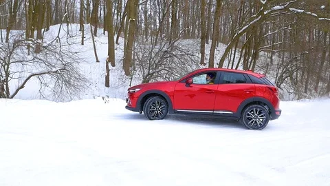 Red car drifts on snow Stock Footage 87329962