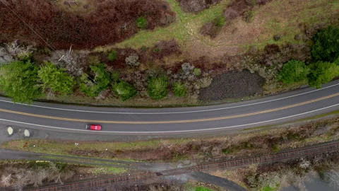 Red car drives fast on rural highway. Aerial view Stock Footage 149335378