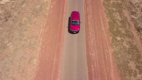 Red Car Driving in Outback Stock Footage 146500965