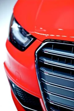 Red car front closeup. red modern vehicle design. Photos