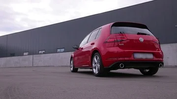 Red car hatchback standing at parking place on a summer day Video stock 85830369