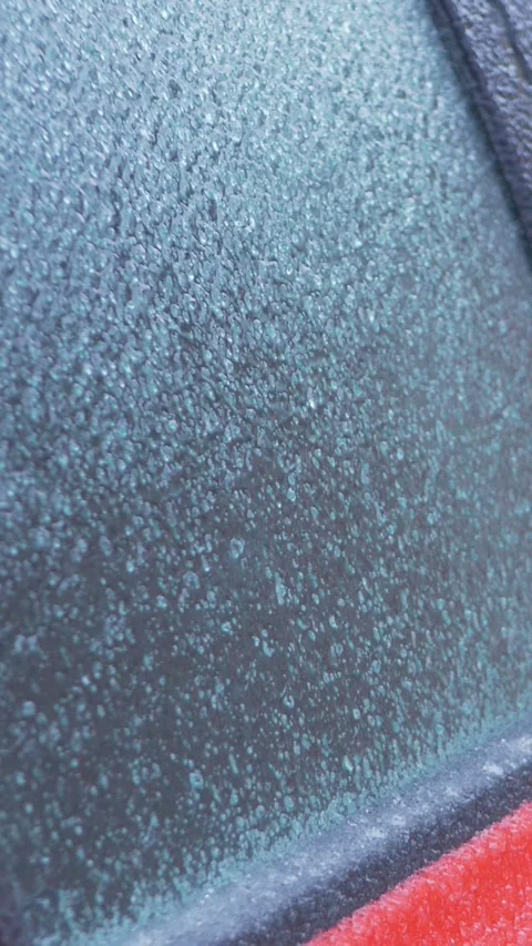 Red car with ice on windows and door Stock Footage 316560282