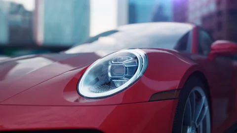 Red car in an urban environment camera movement along the front of the car Stock Footage 232204174