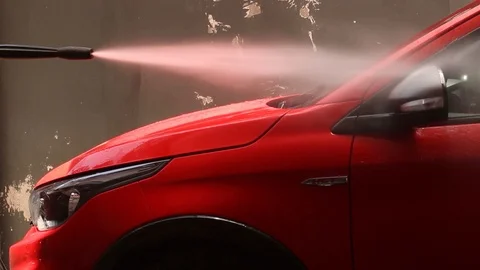Red car wash with pressure washer Stock Footage 123799712