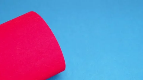 Red cardboard on a blue background. The texture of the cardboard. Stock Footage 157275152