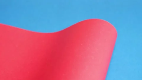 Red cardboard on a blue background. The texture of the cardboard. Stock Footage 157444216