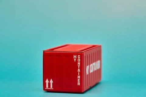 Red Cargo Container on Blue Background Photos