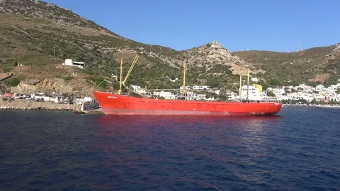 Red Cargo Ship Anchored at the Port Vídeo Stock 70604731