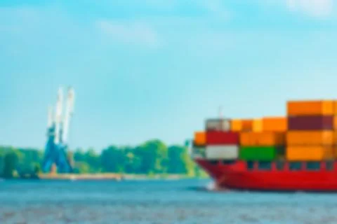 Red cargo ship - blurred image 库存照片