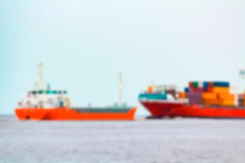 Red cargo ship - blurred image 写真素材