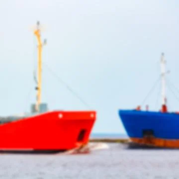 Red cargo ship - blurred image 스톡 사진