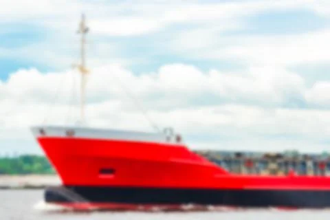 Red cargo ship - blurred image 스톡 사진
