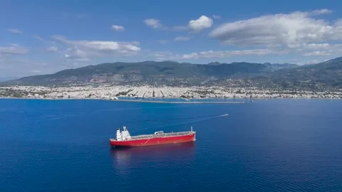 Red Cargo Ship off Kalamata Coast with Speedboat Wake Stock Footage 336794052
