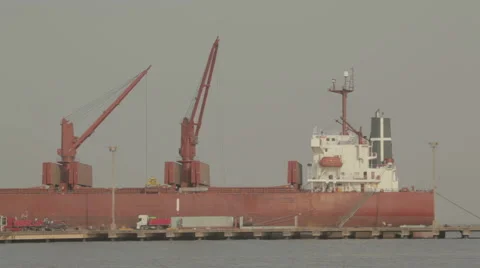 Red Cargo Ship unloading 스톡 동영상 64306443