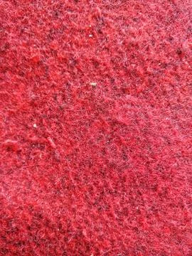 Red carpet fabric texture background close-up Stock Photos