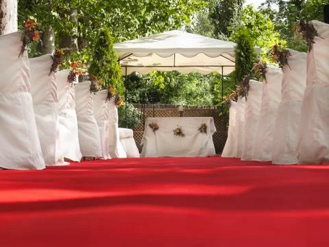 Red carpet patch to altar for outdoor wonderful wedding Stock Photos