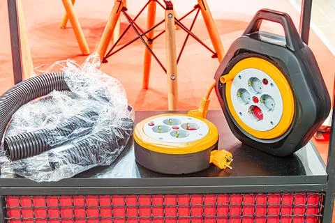 Red carpet, patterned mesh backdrop, industrial generator, yellow and black c Stock Photos