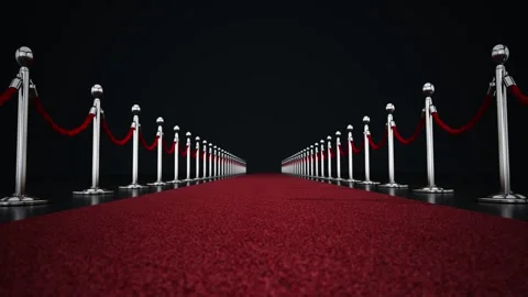 Red carpet with silver posts and velvet ropes on black background Stock Footage 294179228