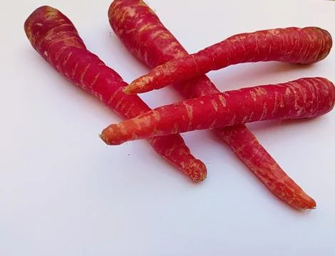 Red carrots on a white background Foto stock
