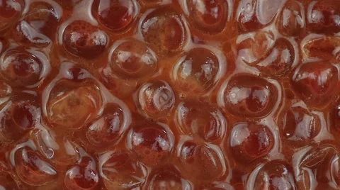 Red caviar background close up . Rotates plate with red caviar Stock Footage 67943367