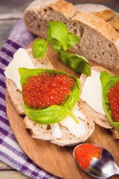 Red caviar on bread Stock Photos