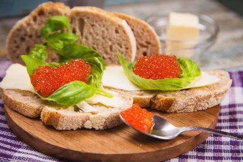 Red caviar on bread Stock Photos