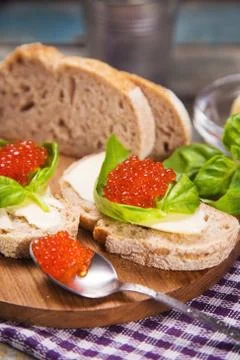 Red caviar on bread Stock Photos