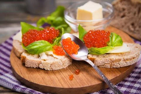 Red caviar on bread Stock Photos