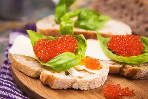 Red caviar on bread Stock Photos