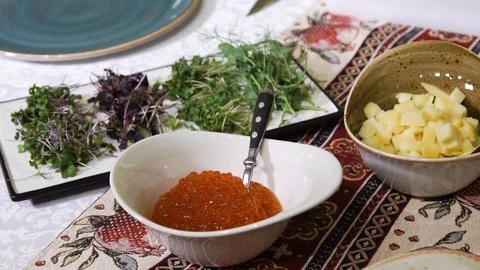 Red Caviar in a Cup on the Holiday Table. Traditional Russian Snack Stock Footage 99312842