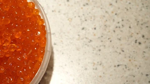 Red caviar in a jar top view. The movement of the frame from right to left Video stock 119359024
