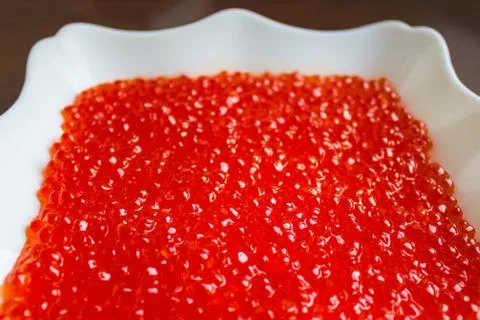 Red caviar on a large dish. Stock Photos