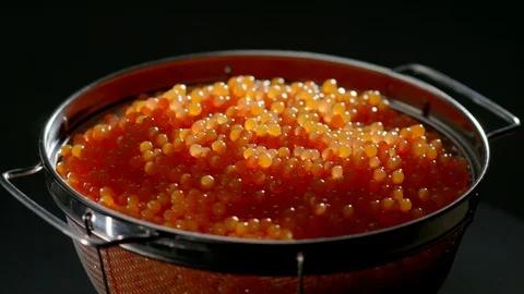 Red Caviar rotated background. Close-up salmon caviar rotation. Stock Footage 113974559