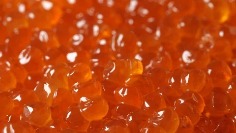 Red caviar rotated background. Salmon caviar macro. Low angle Video stock 122522426