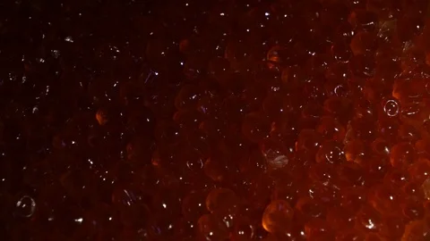 Red caviar shining in the light. The play of light from darkness to bright image Video stock 119352617