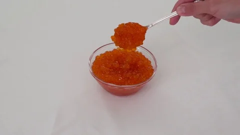 Red caviar spoon from above Stock Footage 77358401