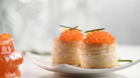 Red Caviar in a spoon, fish roe in a glass jar. Close-up of salmon caviar Stock Footage 296532020
