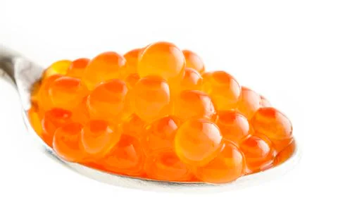 Red caviar on a spoon Stock Photos