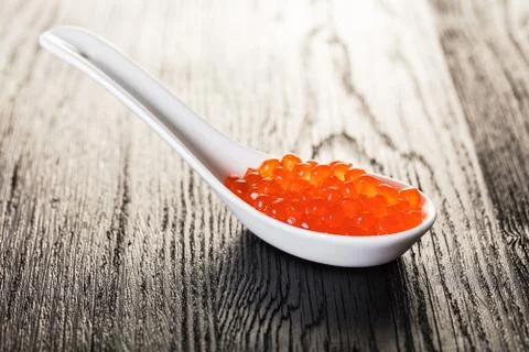 Red caviar in a spoon Stock Photos
